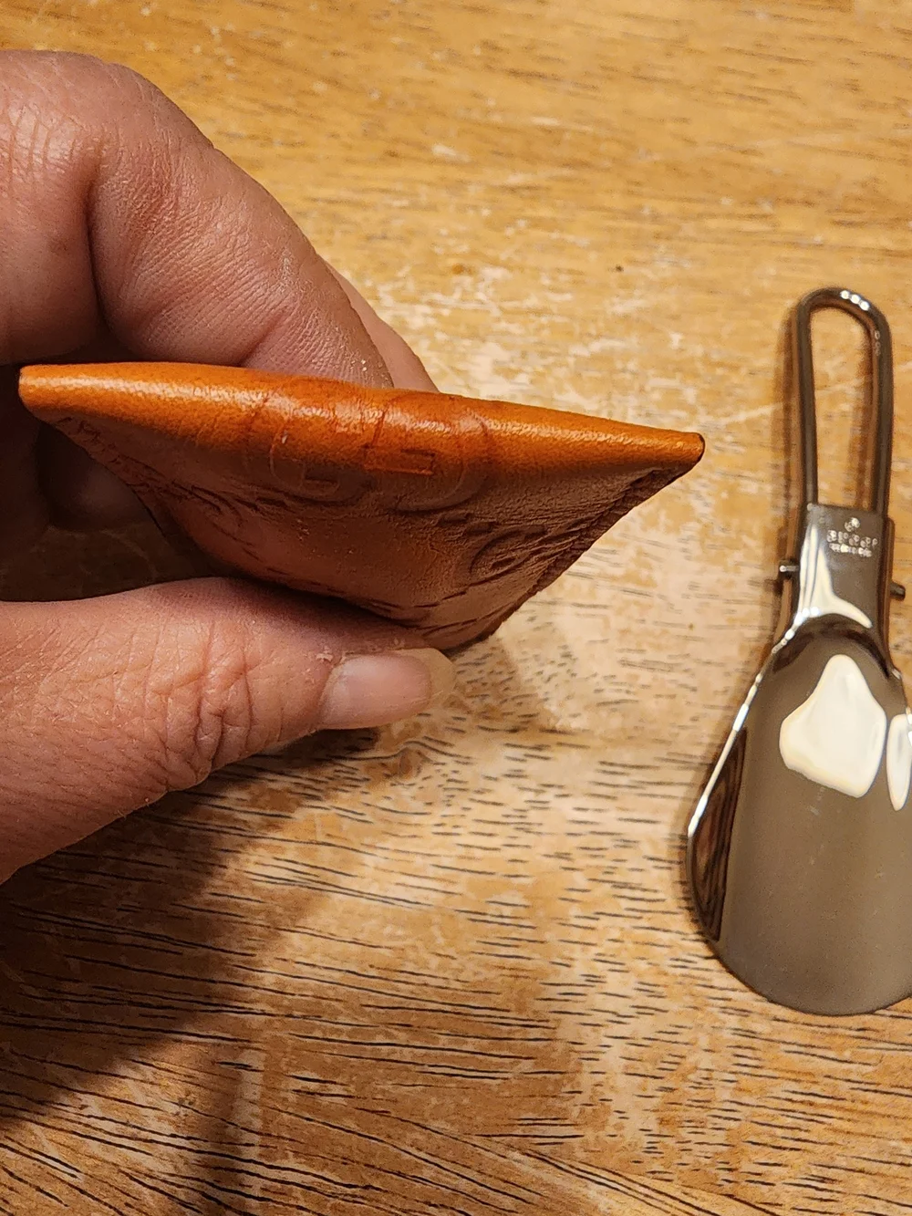 vintage Gucci portable metal shoehorn housed in an embossed brown Guccissima GG